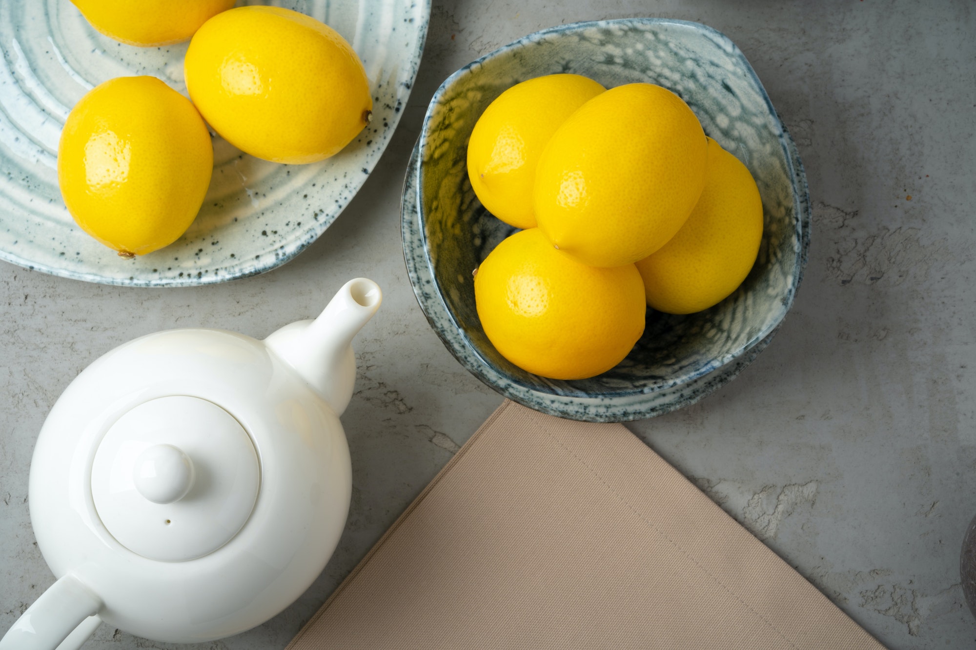 New ceramic dishware with several lemons for decoration