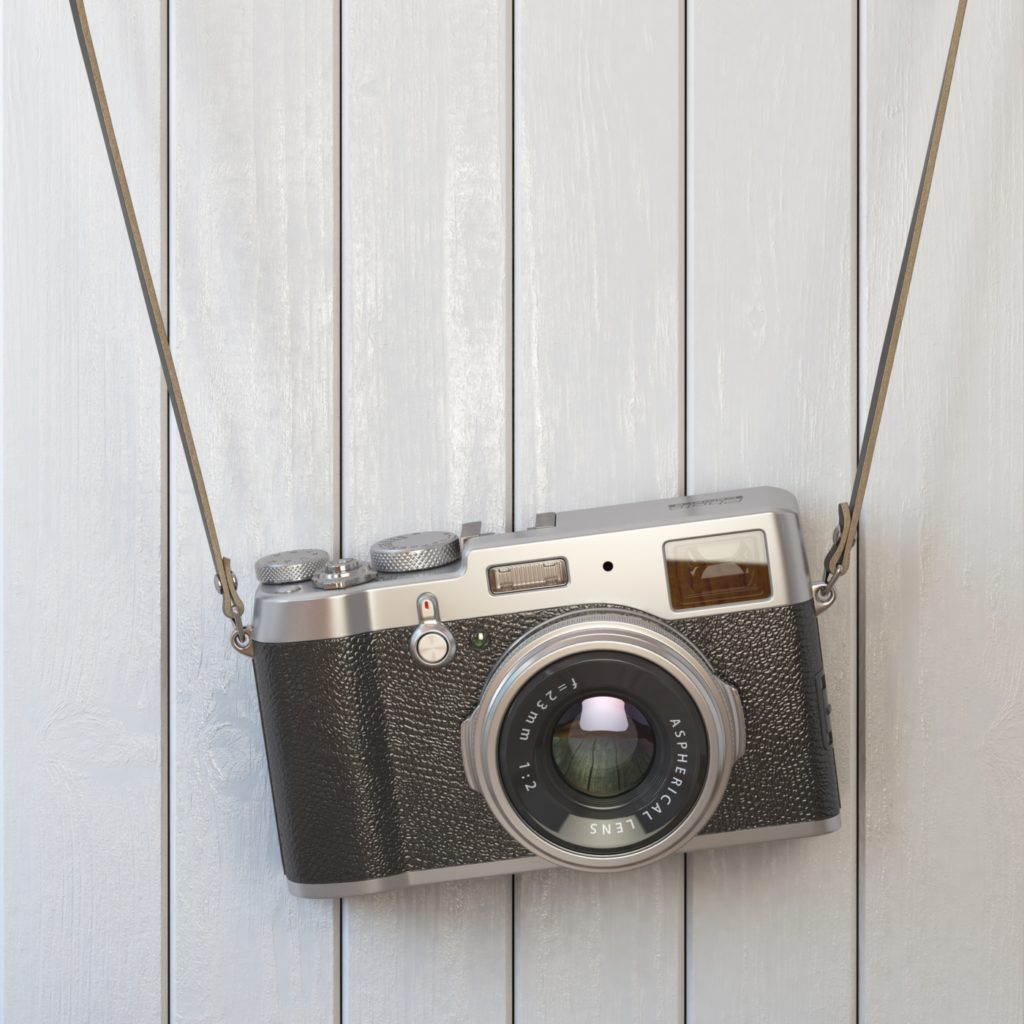 Vintage retro photo camera hanging on the white wooden wall.