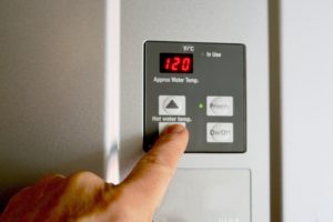 Finger on hot water heater control unit