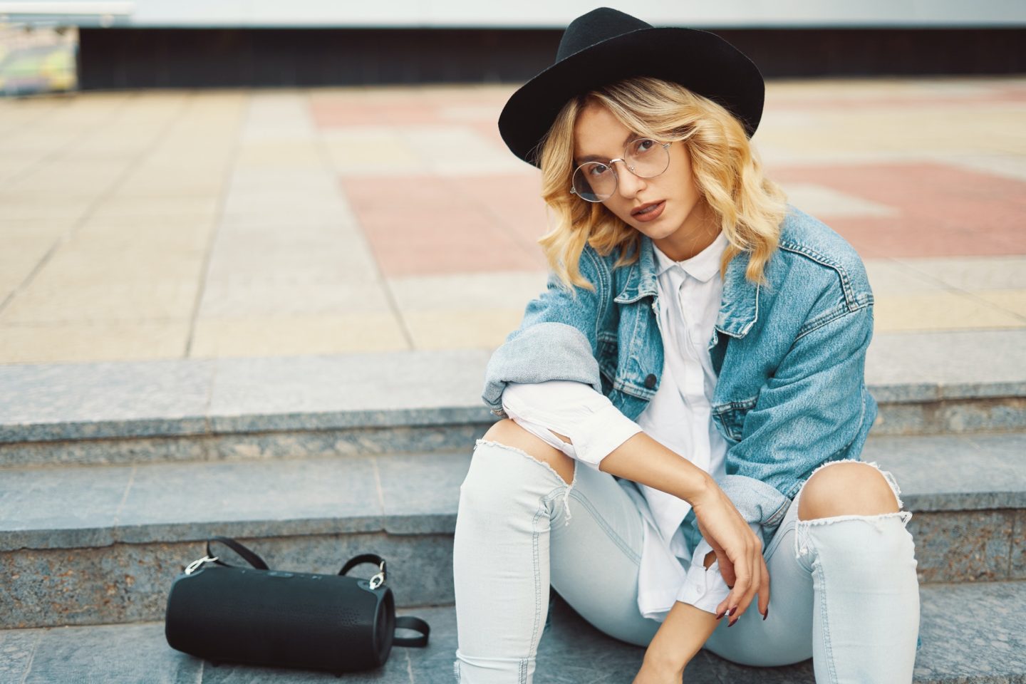 Fashionable modern woman with glasses in the city