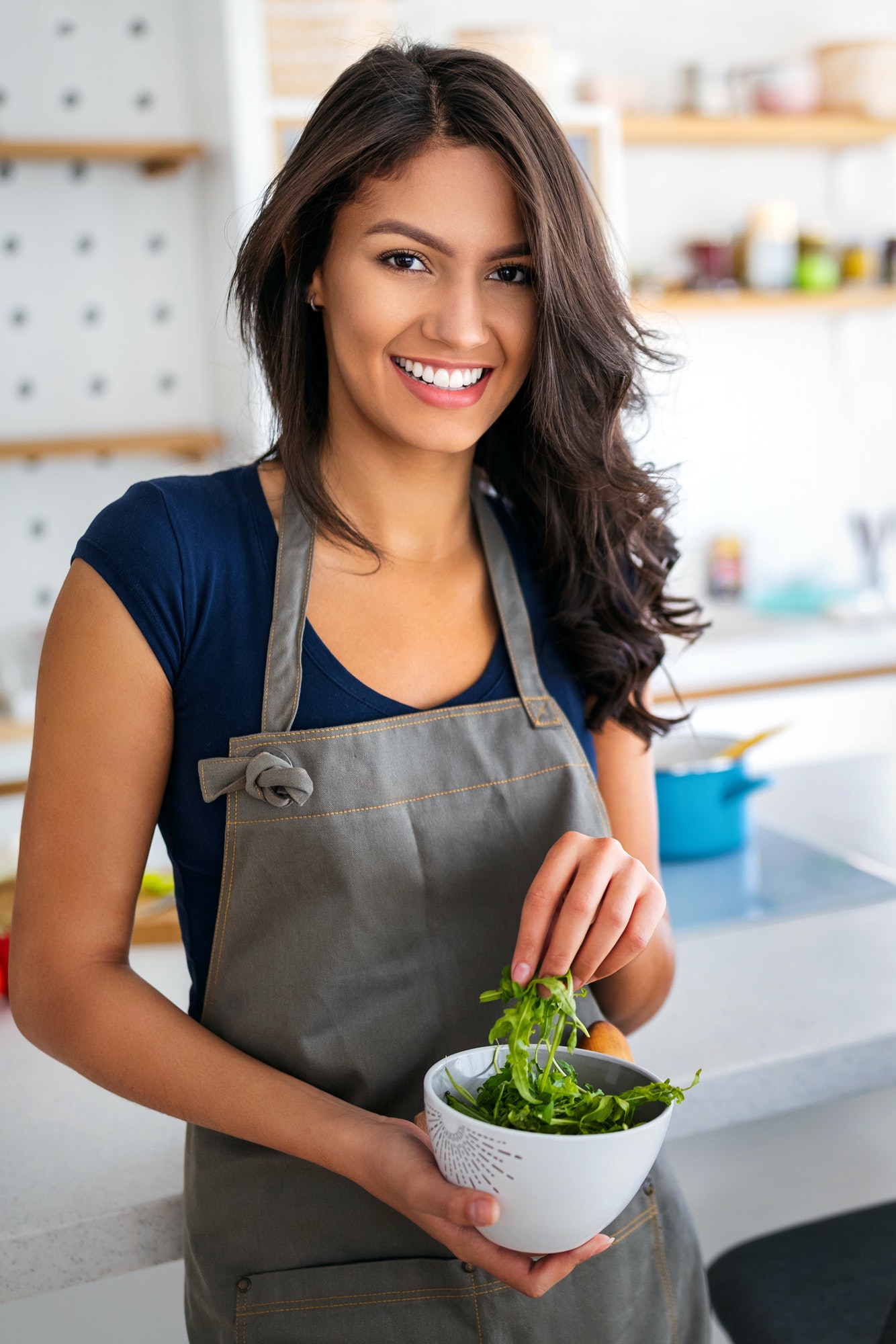 Beautiful healthy woman eating salad. Dieting, healthy lifestyle concept