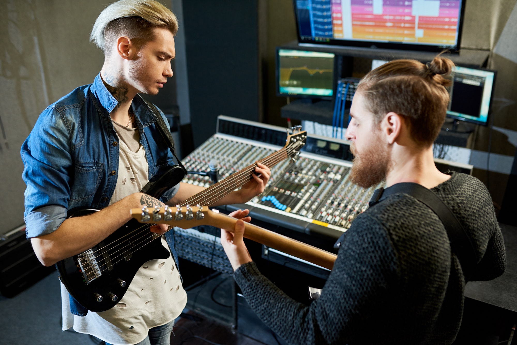 Coworking musicians in recording studio