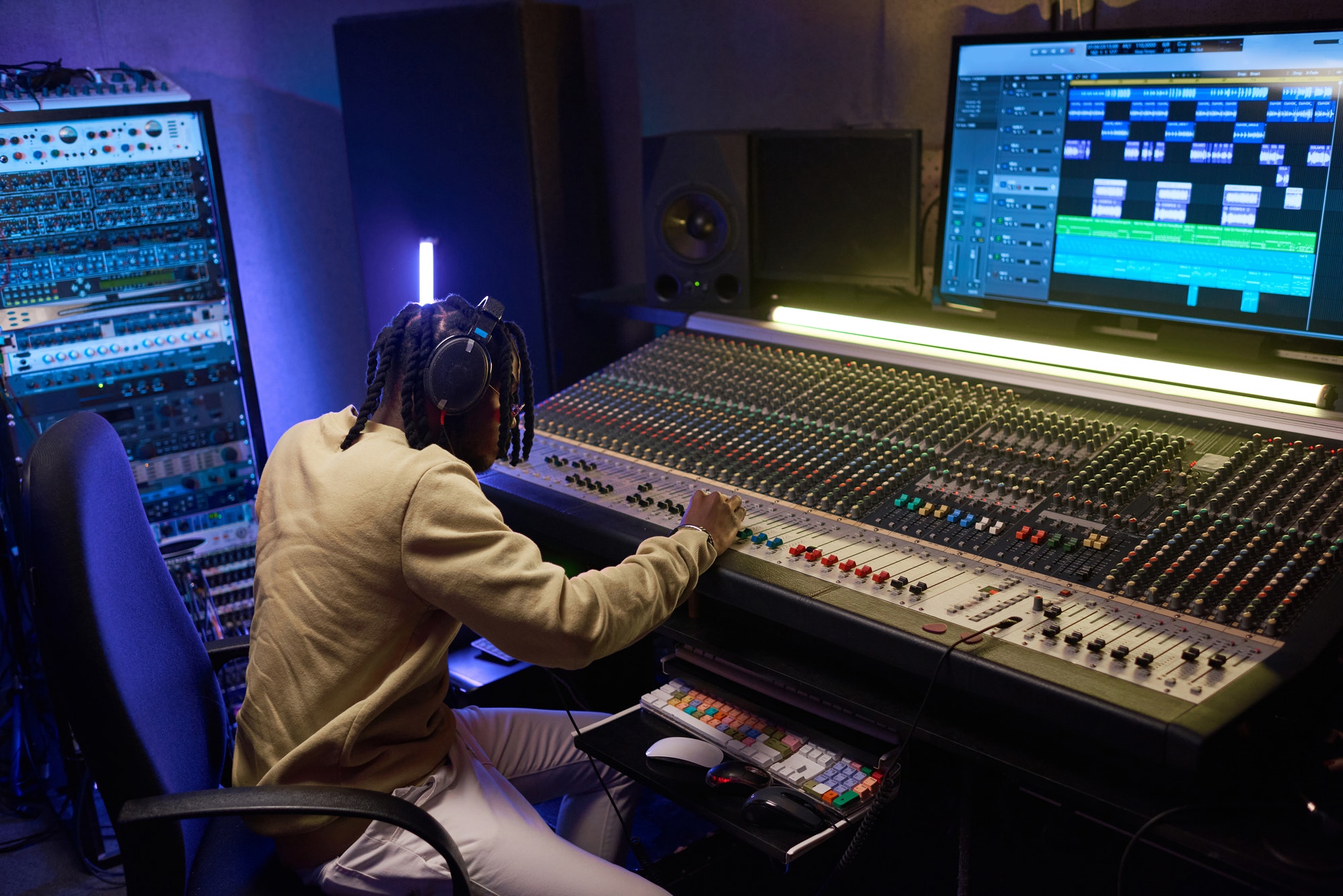 Producer working in digital recording studio