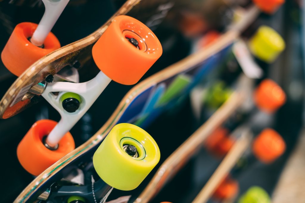 Close Colorful Skateboards Displayed At Rack On Sale In Shopping