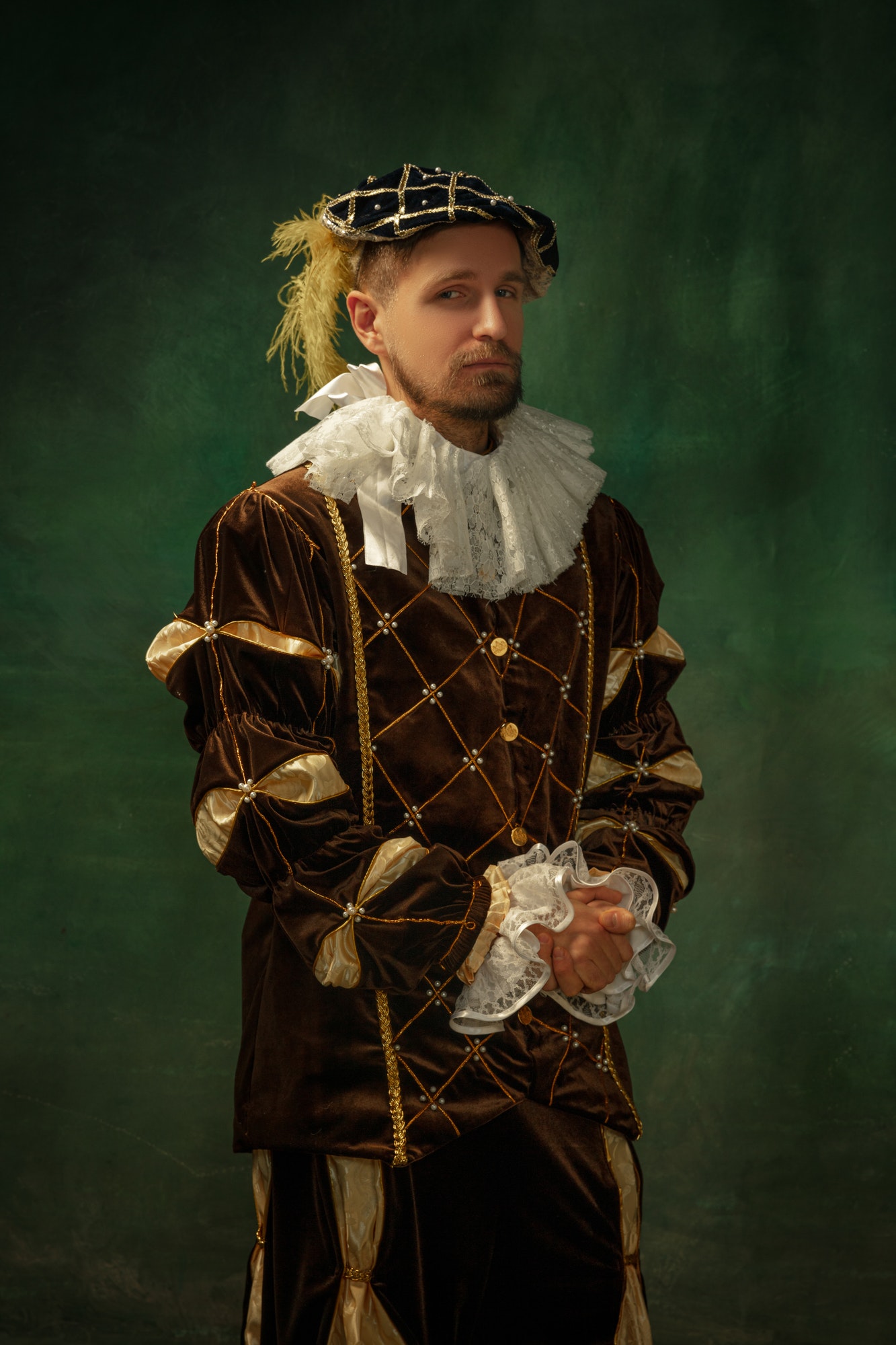 Medieval young man in old-fashioned costume